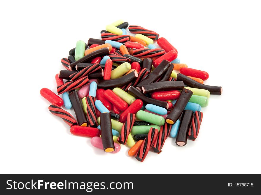 A mound colorful candy isolated over a white background. A mound colorful candy isolated over a white background