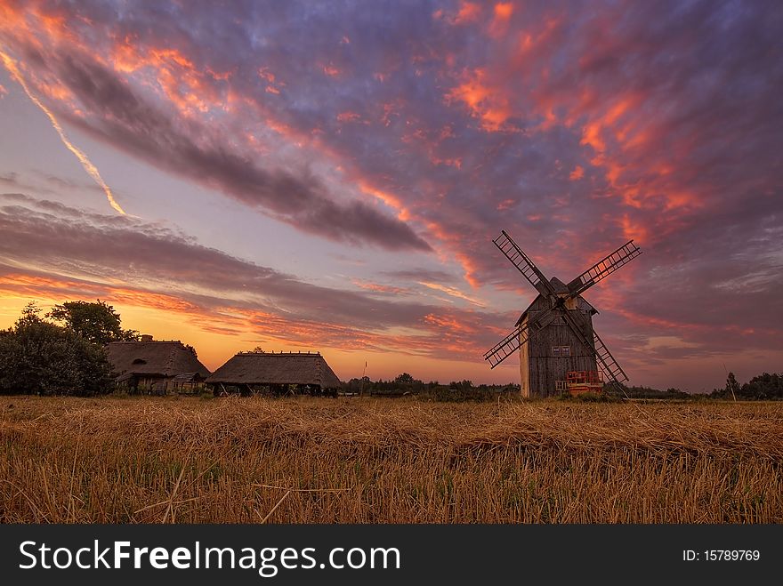 Country landscape with the windmill on field at sunrise. Country landscape with the windmill on field at sunrise