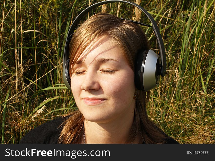 Young woman listening to music.
