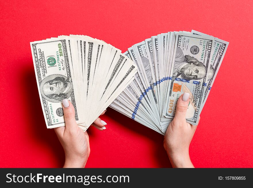 Fan Of New One Hundred Dollar Bills In One Female Hand And Old One Hundred Dollar Bills In Another Hand On Colorful Background.