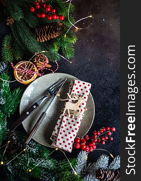 Table setting for festive holiday Christmas dinner on stone  background with copy space. Table setting for festive holiday Christmas dinner on stone  background with copy space