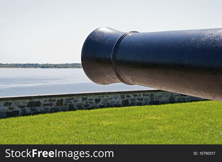 19th century cannon barrel guarding St. Lawrence River in Canada. 19th century cannon barrel guarding St. Lawrence River in Canada