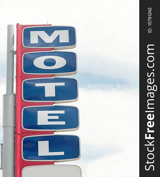 Motel road sign with sky copy space