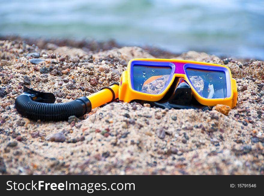 Diving mask and snorkel on the beach in summer. Diving mask and snorkel on the beach in summer