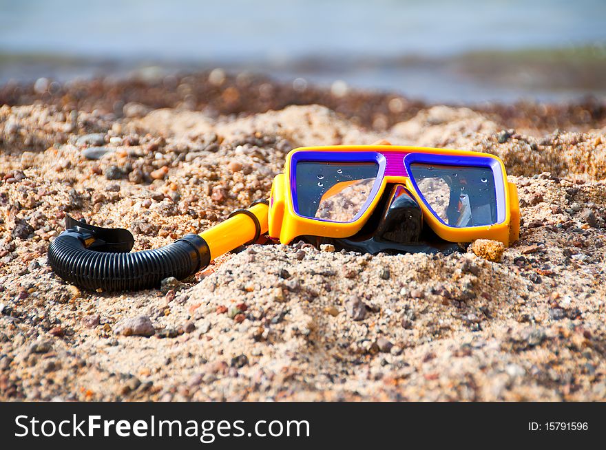 Diving mask and snorkel on the beach in summer. Diving mask and snorkel on the beach in summer