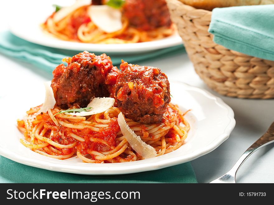 Spaghetti with tomato sauce and large meatballs