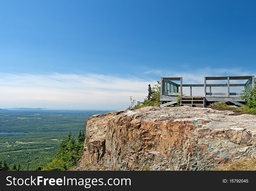 Touristic viewpoint on a cliff, beautiful view from a mountain.