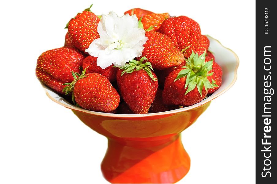 Delicious ripe strawberries on the red plate