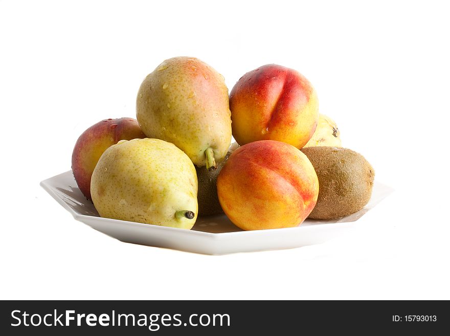 Pears and apricots against a white background. Pears and apricots against a white background