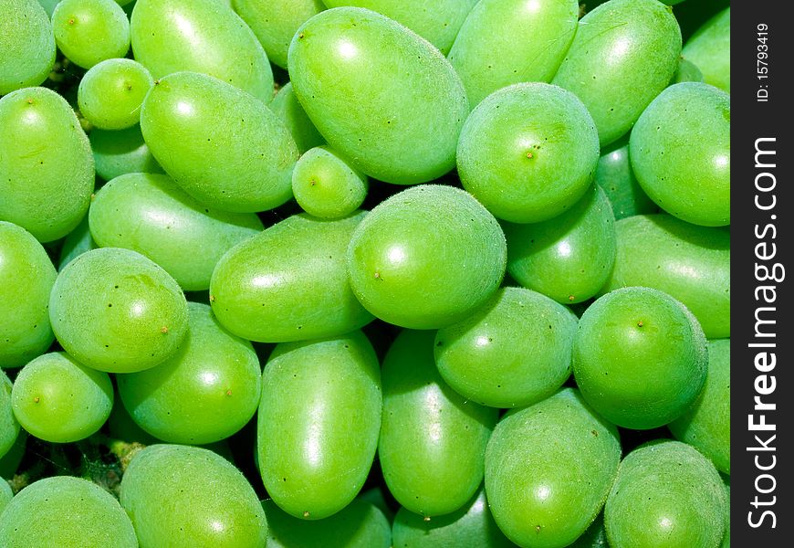 Cluster of green grapes closeup background. Cluster of green grapes closeup background.