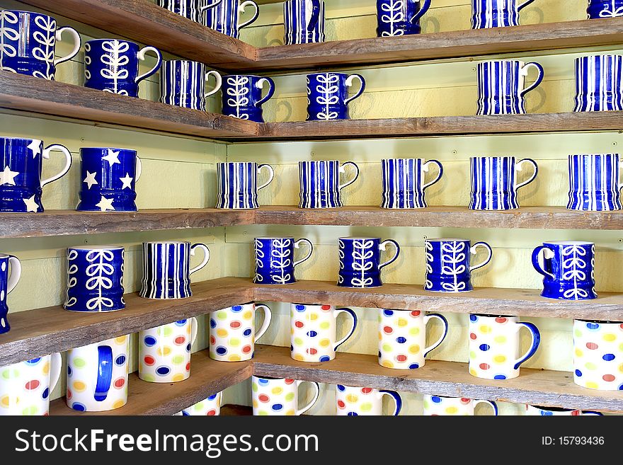 Many coffee cup on wood shelf background