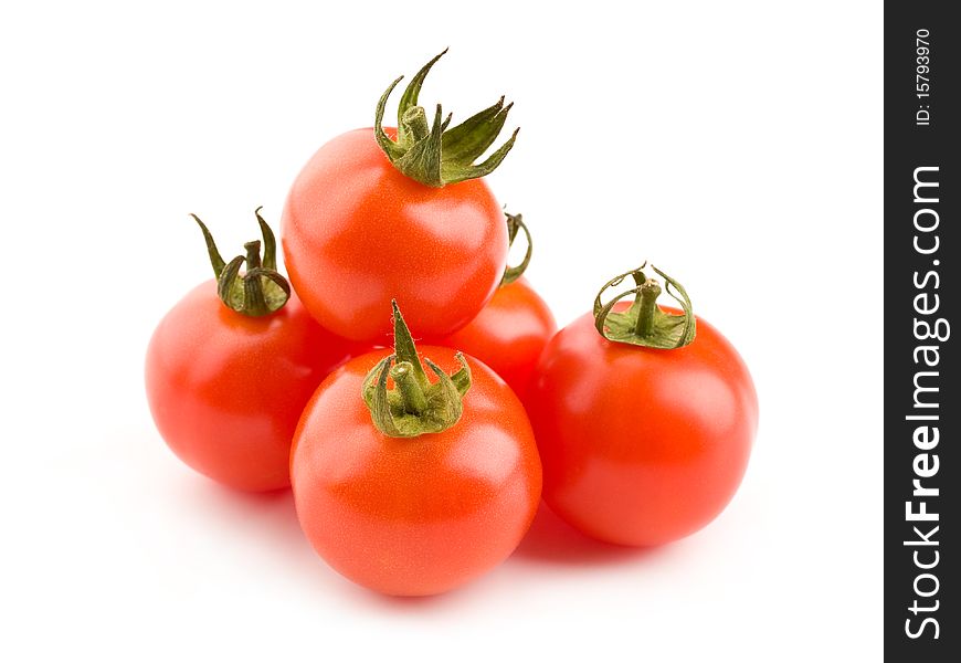 Close up of a pile of cherry tomatoes isolated on white background. Close up of a pile of cherry tomatoes isolated on white background.