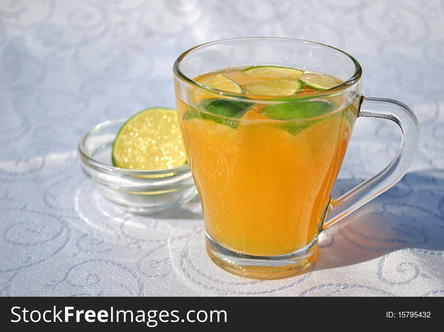 Fresh orange juice with pieces of lemon