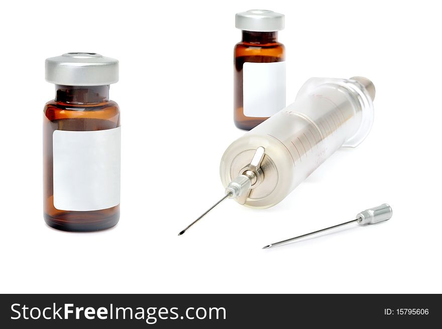 Old glass syringe against white background