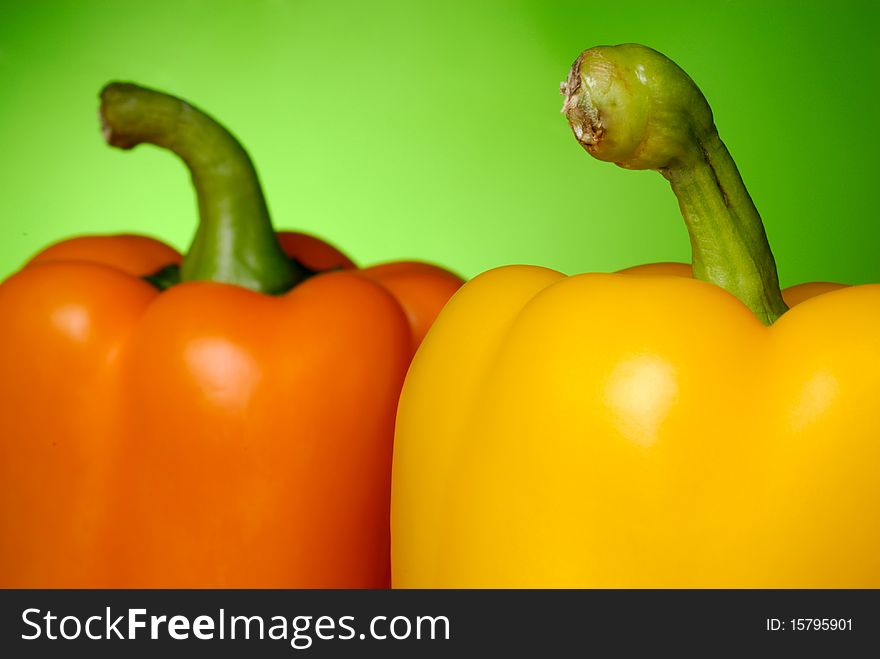 Sweet peppers on green background. Sweet peppers on green background