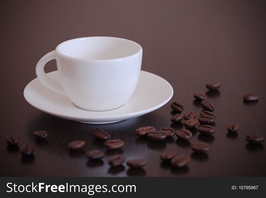 Empty coffee cup with grains
