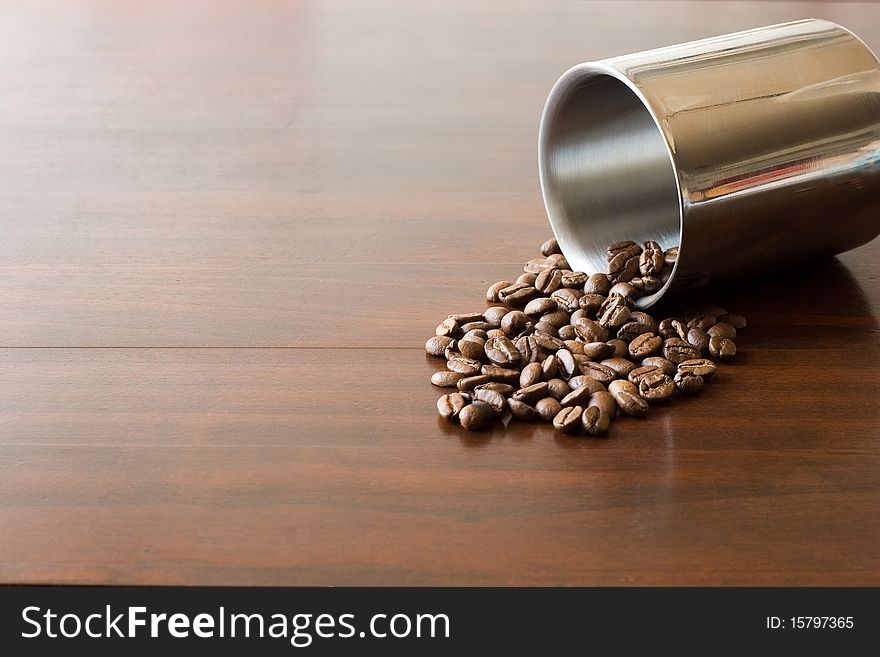 Coffee beans on brown table