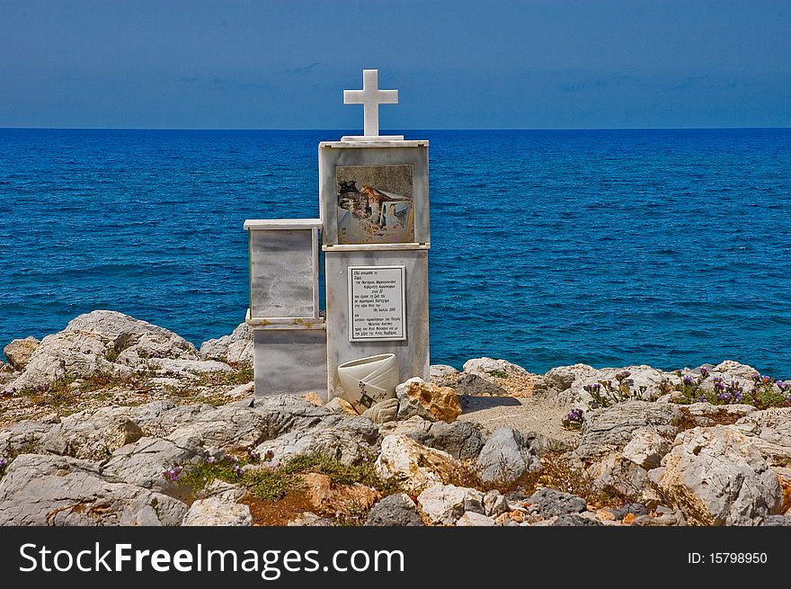 Under the cross near the beach of Crete people put remembrances. Under the cross near the beach of Crete people put remembrances