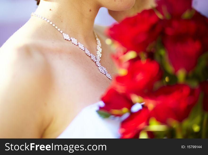 Necklace And Bunch Of Red Roses