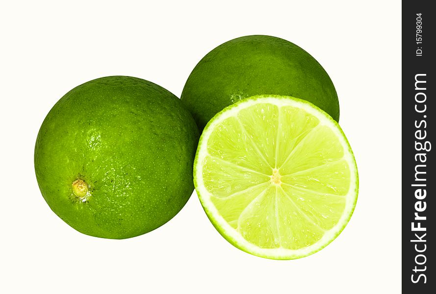 Two limes and half isolated on a white background