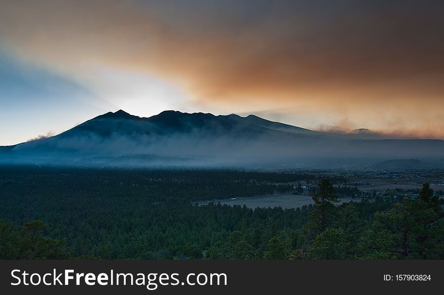 San Francisco Peaks. Day 4 of the Schultz Fire, Flagstaff, Arizona. At this point, the fire has consumed over 12,000 acres, including parts of the Schultz Pass area and northern flanks of the Dry Lake Hills, and most of the eastern side of the San Francisco Peaks. San Francisco Peaks. Day 4 of the Schultz Fire, Flagstaff, Arizona. At this point, the fire has consumed over 12,000 acres, including parts of the Schultz Pass area and northern flanks of the Dry Lake Hills, and most of the eastern side of the San Francisco Peaks.