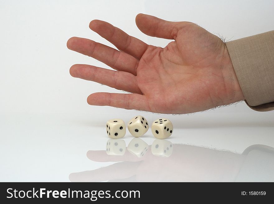 Rolling dice - conceptual photo, white background
