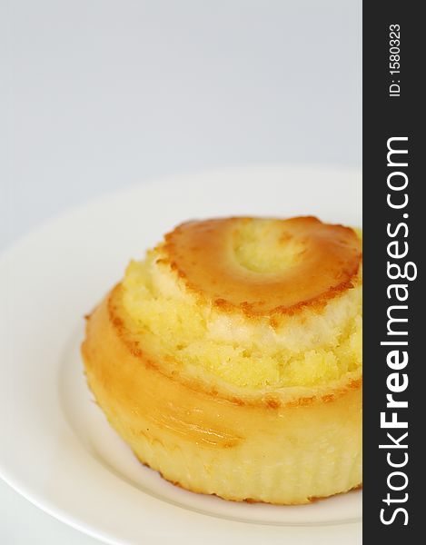 Sweet Bun on White Plate. Shallow DOF. Sweet Bun on White Plate. Shallow DOF.