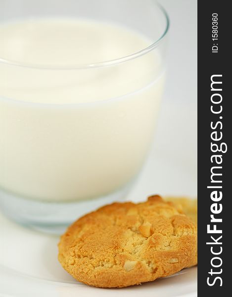 Cookies on White Plate and Glass of Milk. Shallow DOF. Cookies on White Plate and Glass of Milk. Shallow DOF.