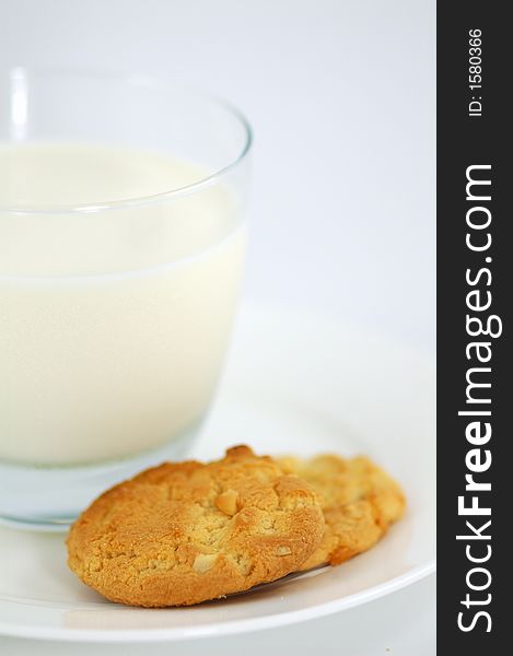 Cookies on White Plate and Glass of Milk. Shallow DOF. Cookies on White Plate and Glass of Milk. Shallow DOF.