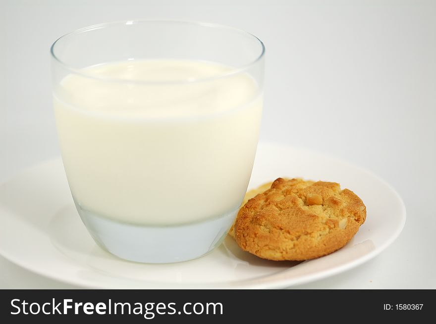 Cookies on White Plate and Glass of Milk. Shallow DOF. Cookies on White Plate and Glass of Milk. Shallow DOF.