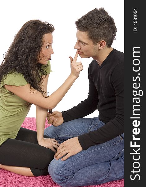 Young couple feeding each other chocolate (white background)