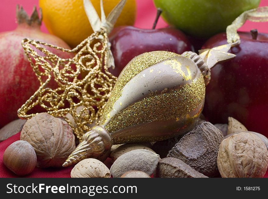 Fruit, nuts and ornaments ready to be displayed. Fruit, nuts and ornaments ready to be displayed