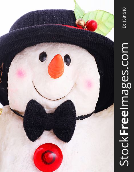 Cute snowman doll captured in close up over white background. Cute snowman doll captured in close up over white background