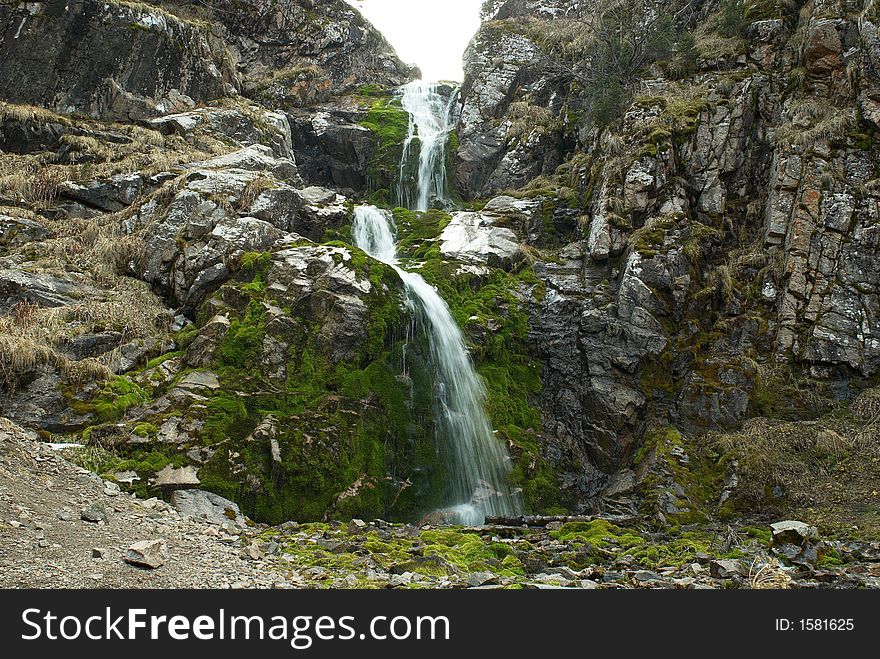 Waterfall by autumn