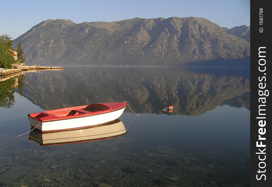 A lonely boat in peaceful cove. A lonely boat in peaceful cove