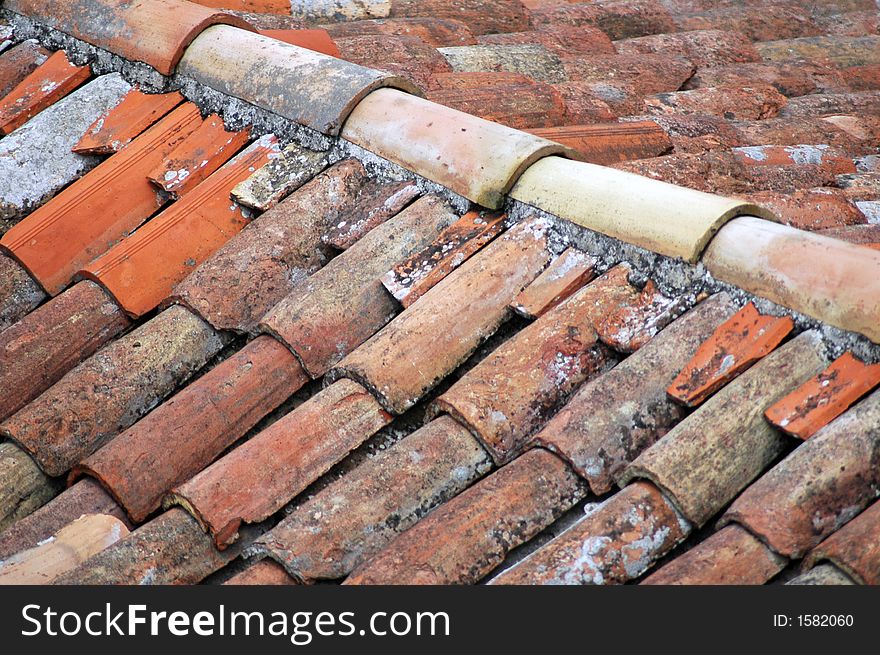 Part of home - old red tiled roof. Part of home - old red tiled roof