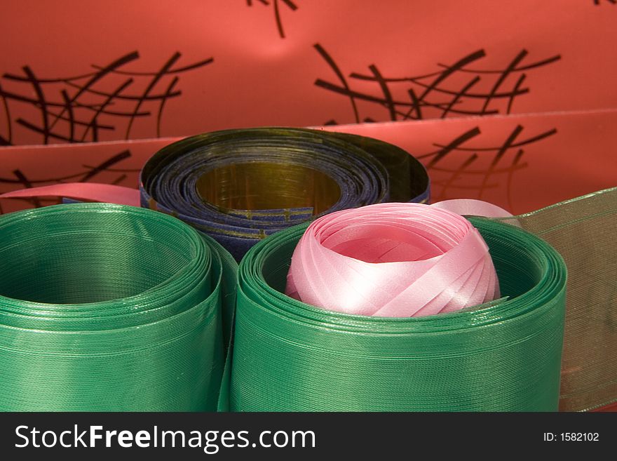 Green, golden and pink gift wrapping ribbons