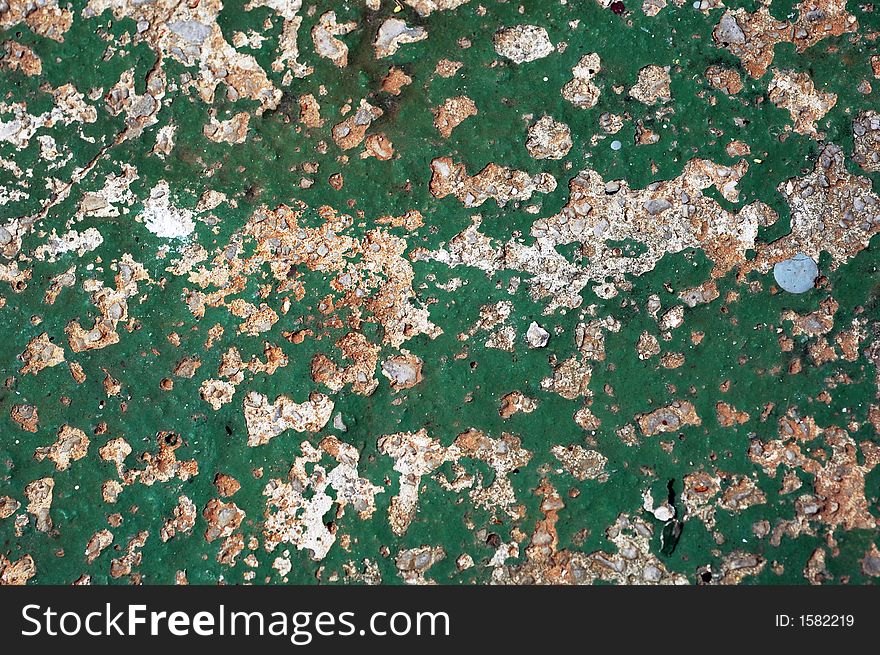 Old and ruined rusted green wall surface. Old and ruined rusted green wall surface