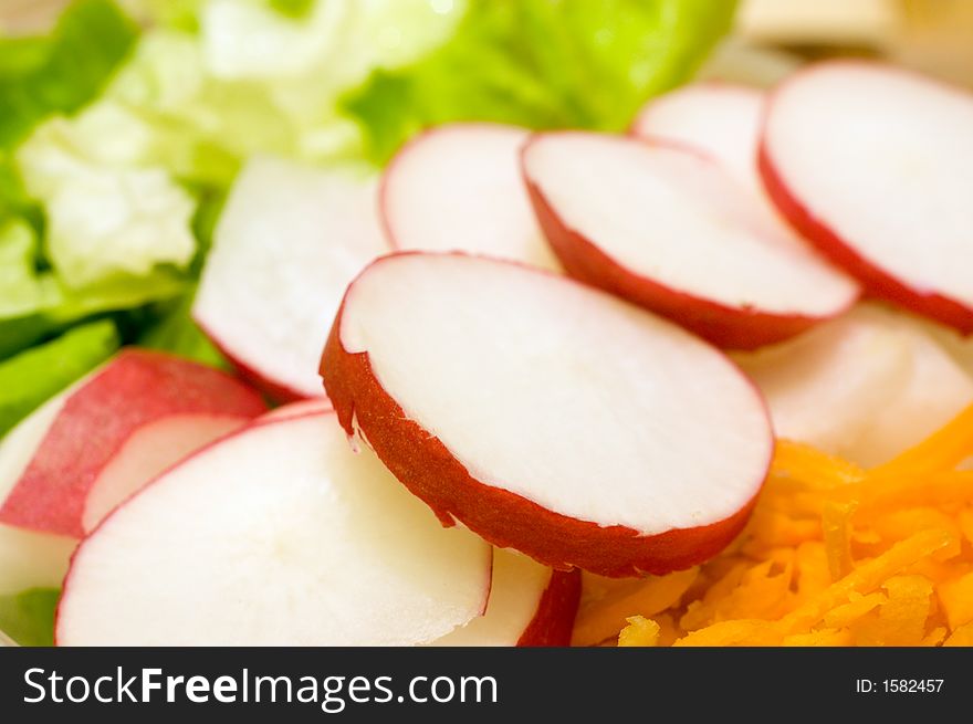 Fresh vegetable salad from carrot, radish and lettuce. Fresh vegetable salad from carrot, radish and lettuce