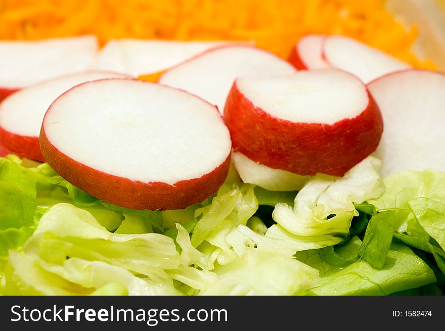 Fresh vegetable salad from carrot, radish and lettuce. Fresh vegetable salad from carrot, radish and lettuce