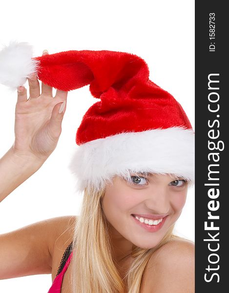 The beautiful girl in a christmas red cap. The beautiful girl in a christmas red cap
