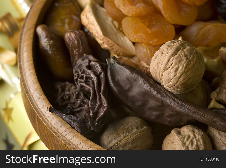 Dry fruit in wooden bowl close up