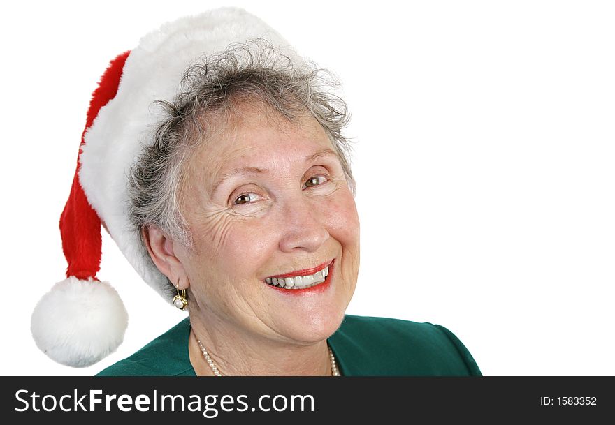 A sweet senior lady in a santa hat, isolated on white. A sweet senior lady in a santa hat, isolated on white