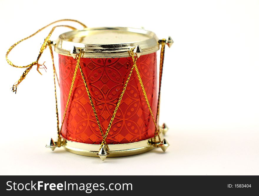 Red and gold drum Christmas tree ornament on white. Red and gold drum Christmas tree ornament on white.