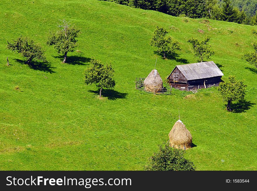 Mountain landscape with shack in a valley. Mountain landscape with shack in a valley