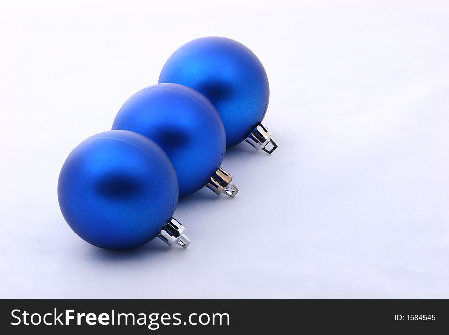 Three blue christmas balls isolated on  background