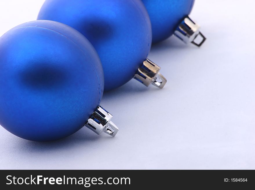 Three blue christmas balls isolated on  background