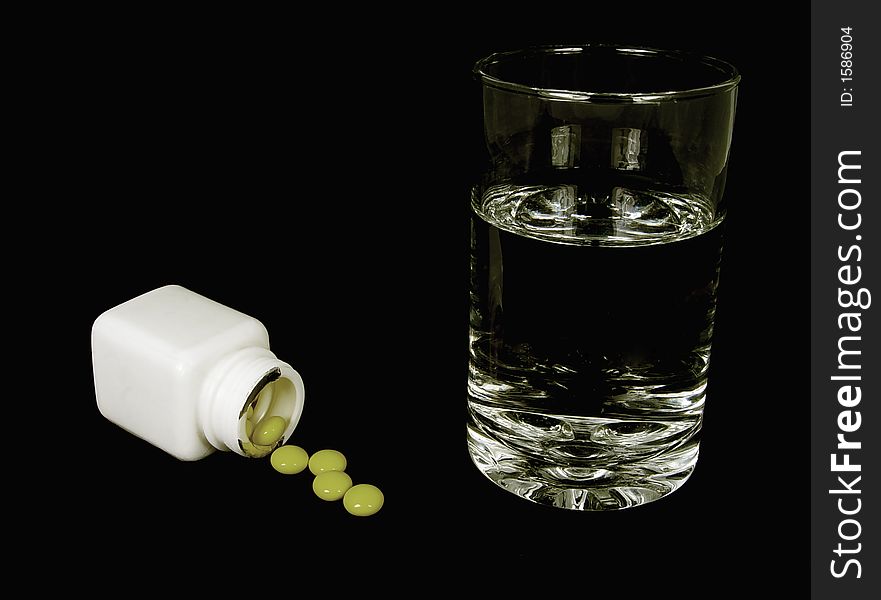 Photo of pills and a Glass Water