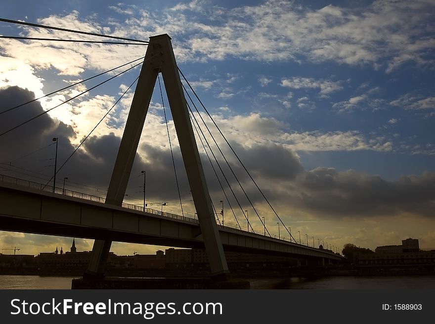 Bridge at sunset with clouds