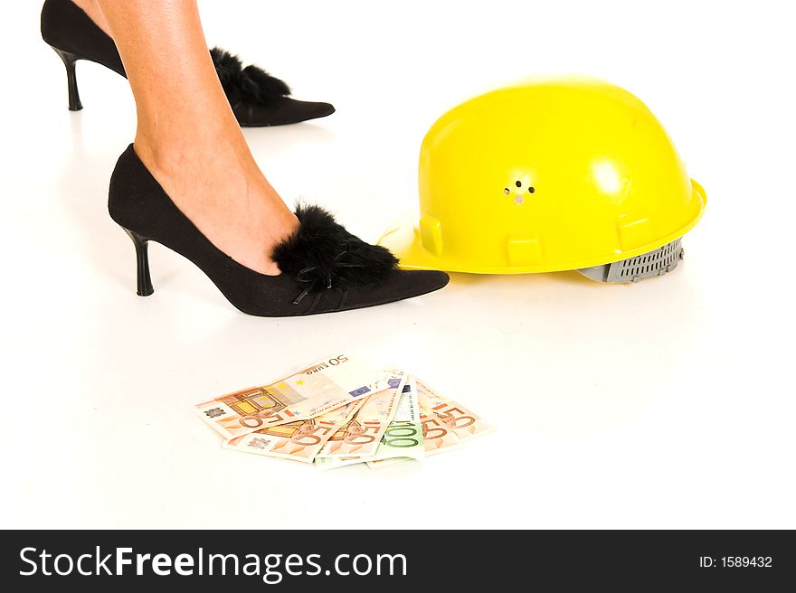 Woman’s legs with cash and helmet on white background